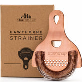A Bar Above antique copper Hawthorne strainer with mirror finish for precise cocktail pouring.