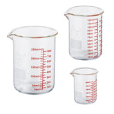 Ackers BORO3.3 mini 2oz glass measuring cup with clear marks for precise pouring.