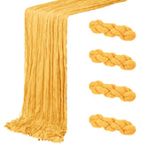 ACSUIT gold cheesecloth table runner laid flat on a table showing elegant texture and romantic ambiance