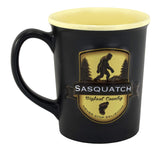 Americaware Bigfoot Emblem Mug front view shows rugged forest design for outdoor enthusiasts