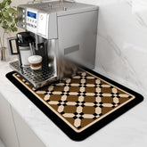 AMOAMI coffee mat with hide-stain PU surface protects counters from spills under the coffee maker.