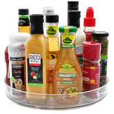 Amolliar 11-inch clear lazy Susan on kitchen counter for spices and condiments.