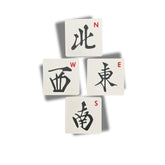 Artful 3D Mahjong North coaster protects surfaces during game night.