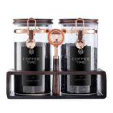 ARTIFORM glass coffee canister set with jars and stand for organized storage.