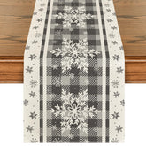 Artoid Mode grey buffalo plaid snowflakes table runner enhances holiday dining aesthetics and surface protection.