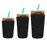 AUEKLLW leopard coffee sleeve Front view showing snug fit and condensation protection.