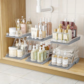 AUGBEAN 3-pack bathroom organizers neatly arranged under the sink for organized skincare.