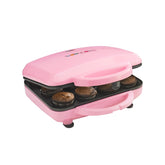 Babycakes fullsize cupcake maker with a latching handle for secure use.