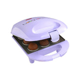 Babycakes mini cake pop maker on a kitchen counter, compact and easy to store.
