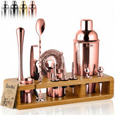 Barillio rose gold bartender kit on bamboo stand for home mixology.