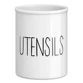 Barnyard Designs ceramic farmhouse utensil holder on counter for organized cooking tools.