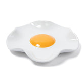 Bee! fried egg ceramic spoon rest on stove, sturdy and heat-safe for cooking.