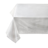 Benson Mills heavy-duty crystal-clear tablecloth over a wood table showcasing natural grain.
