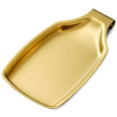 BETTWILL Gold spoon rest on stove top keeps utensils tidy.