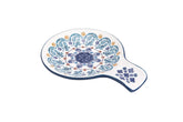 Bico Blue Talavera spoon rest on counter; keeps utensils tidy and ready.