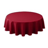 Biscaynebay round Christmas tablecloth 60-inch diameter on table enhances festive dining with elegant texture.