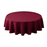Biscaynebay round tablecloth 60-inch diameter in burgundy enhances formal dining ambiance.