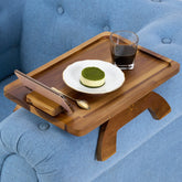BLUEWEST sofa armrest tray in acacia wood close-up, showcasing natural grain and durability.