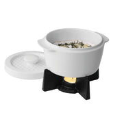BOSKA cheese baker with lid keeps brie warm for easy serving.