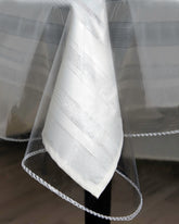 BRODER MFG crystal clear tablecloth protector on a 60x108 table surface—unobtrusive protection.