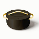 Caraway 6.5 qt Dutch Oven with lid in black, lid-on view for braises.