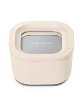 Caraway mini square container with lid in cream color, closed for freshness.