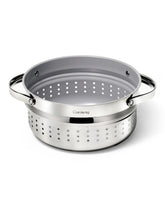 Caraway steamer inside a Dutch oven showing spacious capacity for family meals.