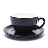 Coffeezone latte art cup and saucer in matte black, ideal for latte art practice and warm drinks.