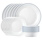 Corelle Caspian dinner plates with navy trim, lightweight for easy daily handling.