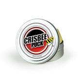 Crisbee Puck seasoning bottle pouring to protect a cast iron skillet.
