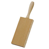 Cuisinox beachwood pasta board with ridges creates grooves that hold sauce.