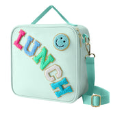 Dark Swan smiley lunchbag in green keeps meals cheerful and ready for school.