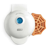 Dash Spiderweb Mini Waffle Maker with spiderweb design creates quick Halloween waffles.