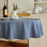 Decorelia denim-blue waterproof round tablecloth on a 70-inch table for spills and gatherings