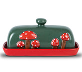 DGUDGU mushroom ceramic butter dish with lid on red counter, stylish and practical.
