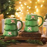 Didaey Christmas tree mug with pink bow in green, 18oz, ideal for cozy cocoa mornings.