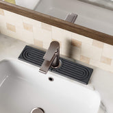 DK177 Stone Faucet Mat in dark gray, front view protecting sink from splashes and showing compact footprint
