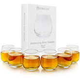 Dobaccio Cool Shot Glasses round-bottom balancing 6pcs on a clean table.