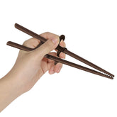 Edison Friends left-handed training chopsticks with silicone rings for a steady beginner grip.
