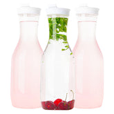 Elegant Disposables clear pitcher with flip-top lid, ideal for spill-free serving at parties.