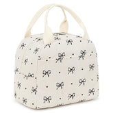 EurCross Cute Bow Tie Lunch Bag in ivory corduroy featuring a front pocket for small essentials.