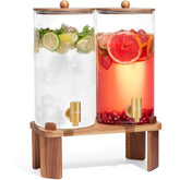 FavorFlavor glass dispenser with wood stand, ready for lemonade and iced tea at events.