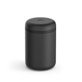 Fellow Atmos canister with open lid for quick air removal and freshness