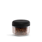 Fellow Atmos 0.4L vacuum canister holding coffee beans with airtight seal