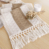 FEXIA boho table runner with tassels on a dining table, adding rustic charm.