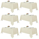 Fitable Ivory tablecloth spreads on a banquet table for 6-8 guests.