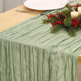 Fixwal sage green cheesecloth runner extended for a dramatic table centerpiece.