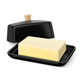 Flexzion butter dish with black ceramic lid on counter.