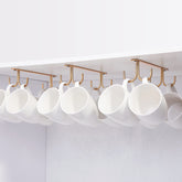 FOMANSH mug rack under cabinet holds mugs neatly, saving space.