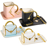 Fovima handbag coffee mug in blue with saucer and spoon, stylish everyday use.